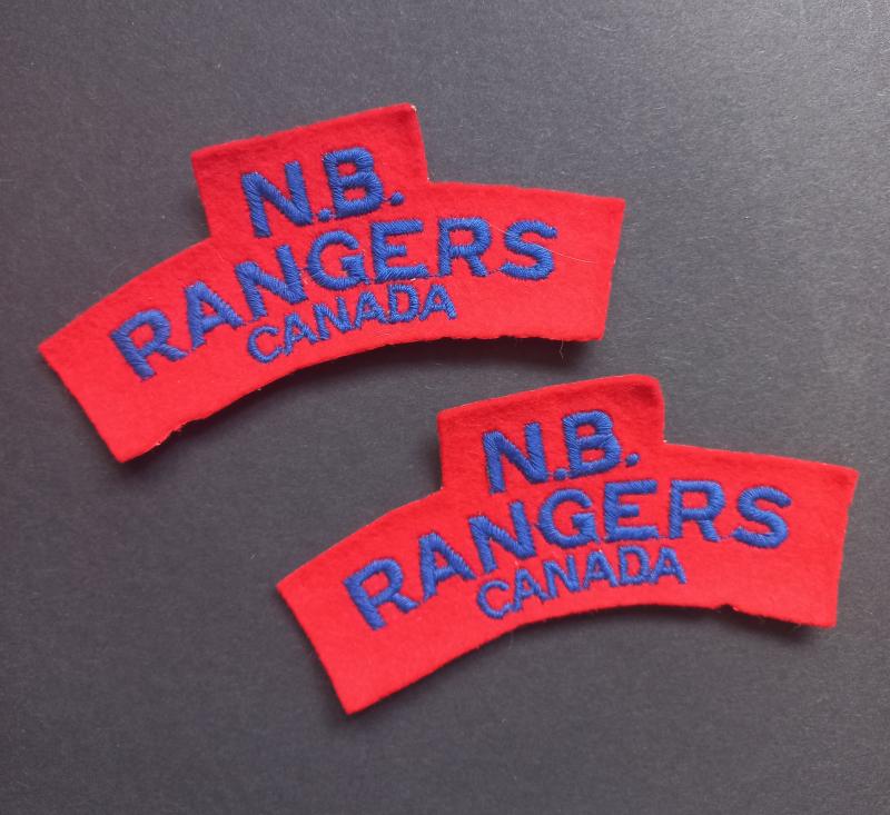 A perfect example of a full matching set typical British made N.B. (New Brunswick) Rangers embroided shoulder titles