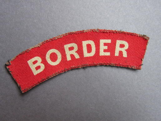 Nicely used printed Border Regiment shoulder title