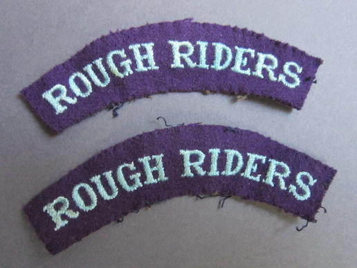 Good example of a set of difficult to find shoulder titles to the Rough Riders.