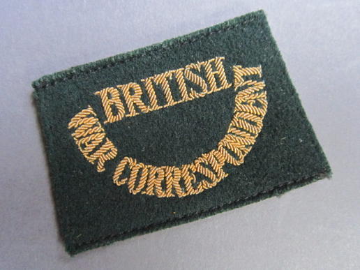 A neat and scarce example of a bullion type British War Correspondent slip on shoulder title