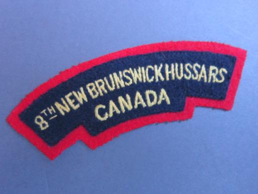 A nice and un-issued British made Canadian shoulder title to the 8th New Brunswick Hussards, 5th Armoured Regiment  