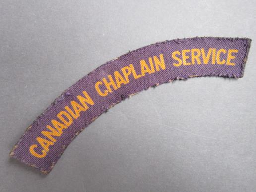 A difficult and sought after example of a British made Canadian Chaplain Service printed shoulder title