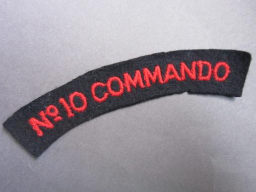 A rare and sought after Number 10 Commando shoulder title in a red on black block type lettering