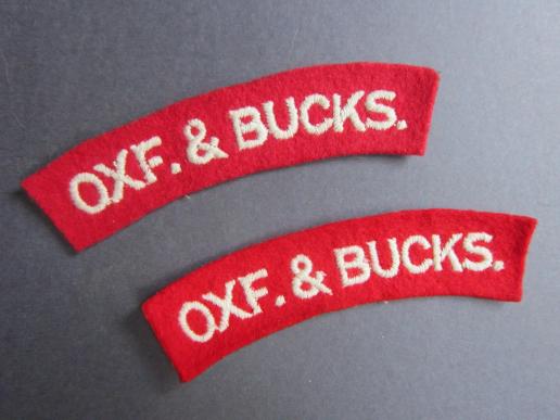 A not so often seen set of white of red Oxfordshire and Buckinghamshire Light Infantry shoulder titles