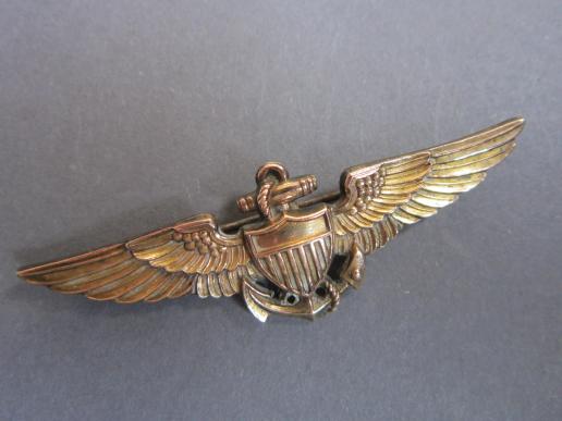 A perfect example of a nicely worn and issued AMICO marked United States Navy/Marines Aviator wing 