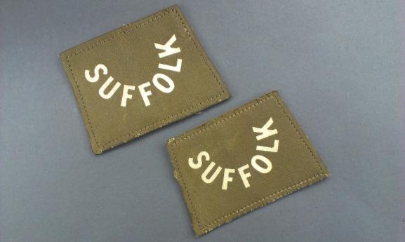A perfect un-issued set of printed (never seen before) British First World War Suffolk slip-on shoulder titles  