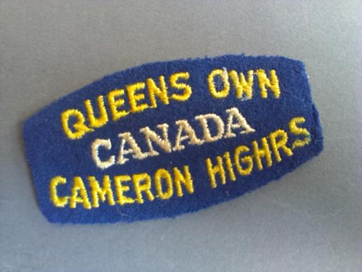 A neat example of a un-issued British made Queens Own Cameron Highlanders, 2nd Division shoulder title 
