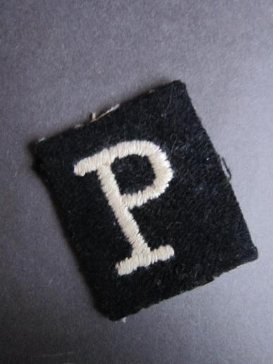 A nice and difficult to find all ranks white “P” on a black background Phantom arm badge