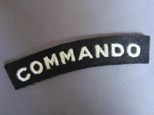 A neat example of a mid war period so called 'block type' lettering Commando white on black shoulder title