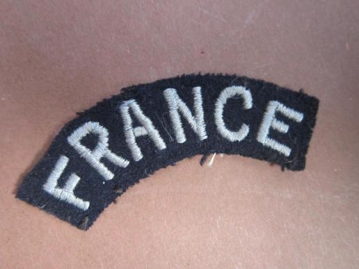 A British made RAF (Royal Air Force) FRANCE shoulder title worn by all French volunteers