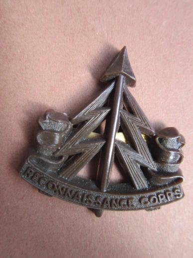A neat British made difficut to find Reconnaissance Corps plastic cap badge