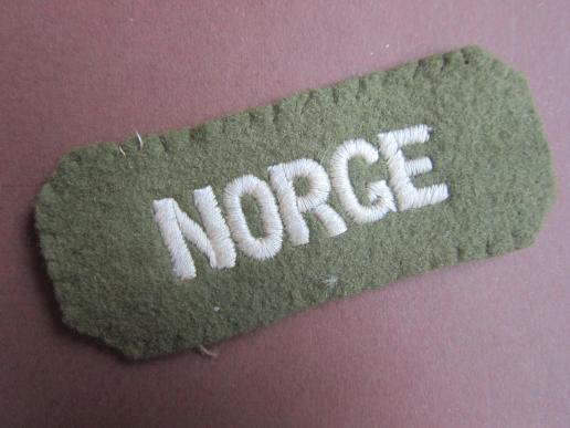 A nice little Norwegian/NORGE shoulder title as intended to wear by Norwegian volunteers on there upper arm of there battle-dress blouse 