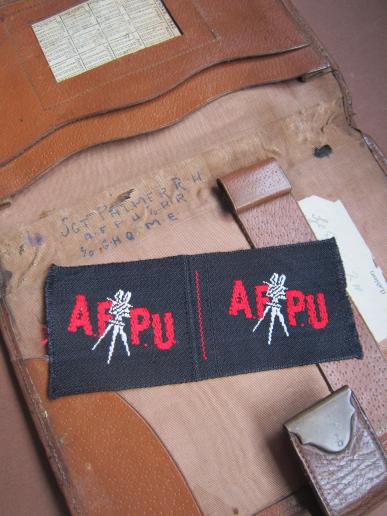 A named grouping of difficult to find British made AFPU (Army Film and Photo Unit) badges