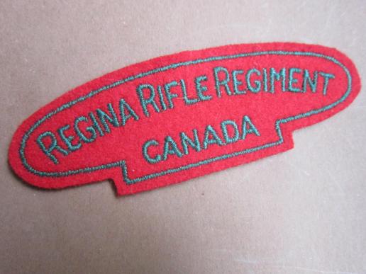 A British/Canadian made embroided Regina Rifles Regiment shoulder title. 