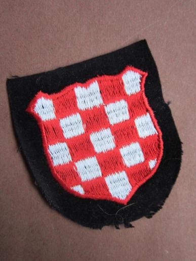 A nice original un-issued German made so called 'Dachau type' 1st type pattern Croatian Waffen-SS Volunteer Sleeve Shield 
