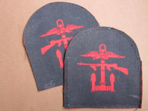 A nice and difficult to find printed matching set of 'thombstone' shape Combined Operations shoulder insignia 