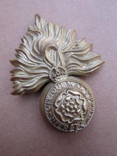 A good example of a wartime made plastic i.e bakelite Royal Fusiliers Cap Badge