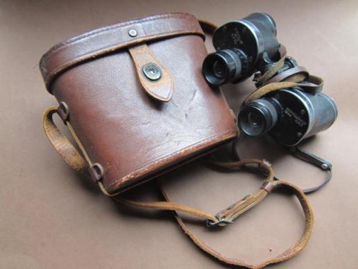 A good example of a nicely issued and used United States M13 type binoculars with it's original and matching all leather carrying case