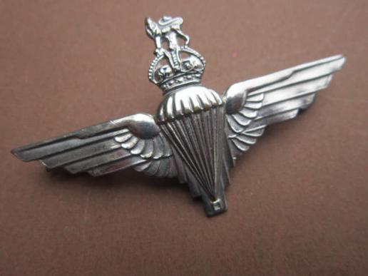 A nice uncommon cut-out (voided) crown nickel plated capbadge to the Parachute Regiment 