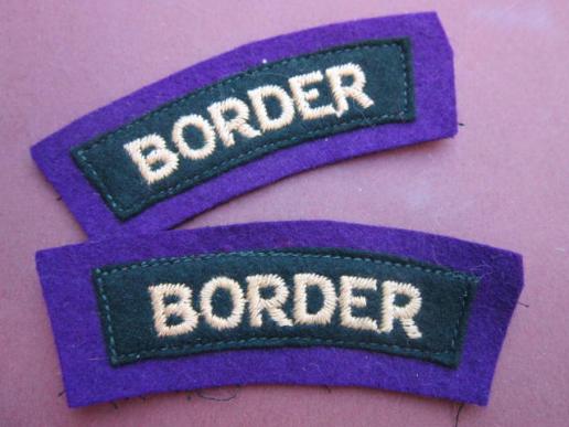 A nice matching pair of early post war 1st type like Border Regiment shoulder titles