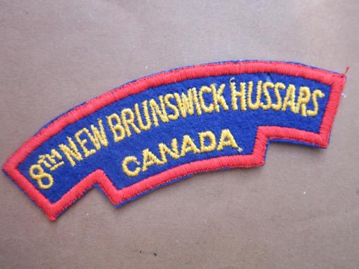 A nice and un-issued British made Canadian shoulder title to the 8th New Brunswick Hussards, 5th Armoured Regiment  