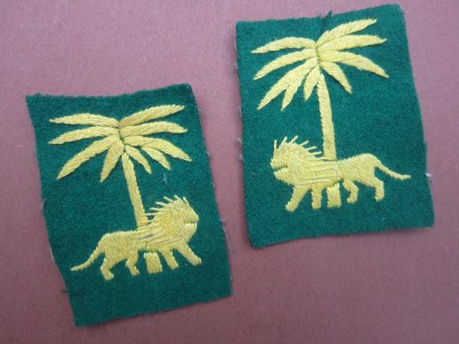 A nice little matching and facing pair of local i.e taylor made '50/'60 Singapore District formation patches 