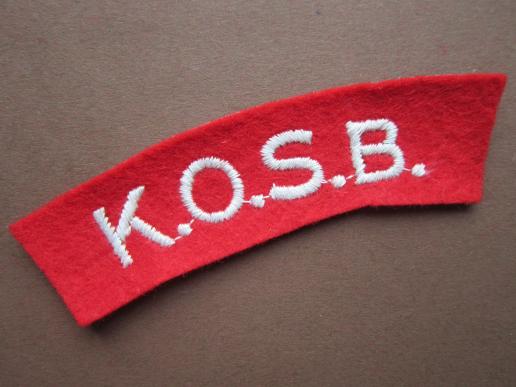 A nice un-issued KOSB (Kings Own Scottish Borderers) white on red embroided shoulder title