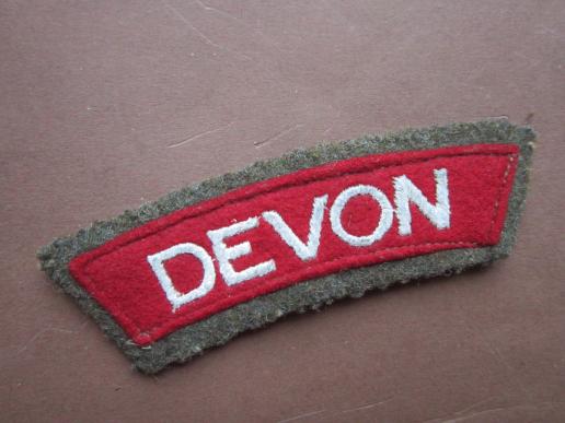 A nice and issued embroided Devonshire Regiment shoulder title