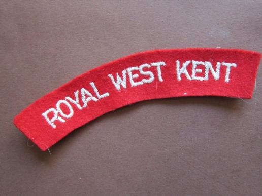 A nice and standard un-issued Royal West Kent white on red embroided shoulder title