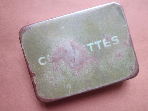 A nicely used British/Canadian standard issue CIGARETTES pocket tin
