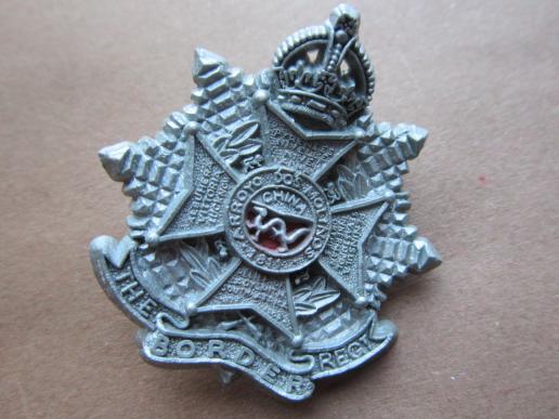 A difficult to find plastic (bakelite) The Border Regiment cap badge