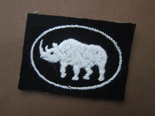 A good un-issued 1st pattern embroided 1st Armoured Division formation badge