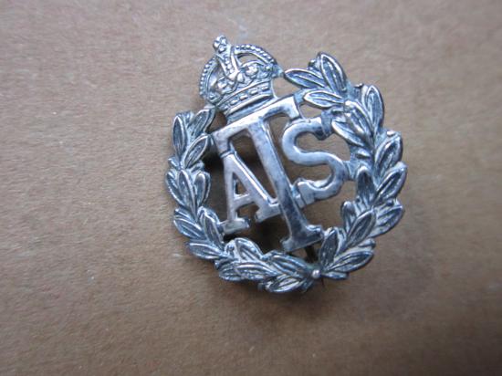 A nice silver (not marked) early war time ATS (Auxiliary Territorial Service) Official numbered (10662) badge i.e insignia
