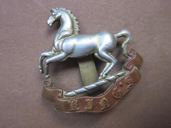 A nice maker marked and issued all metal Kings (Liverpool) Regiment 1927-50 period cap badge