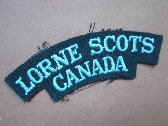 A good British/Canadian made green on black embroided Lorne Scots shoulder title