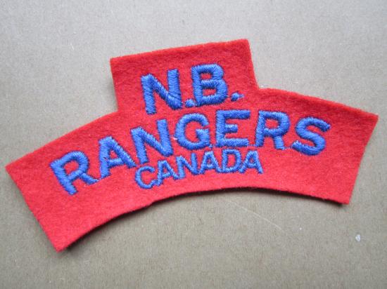 A perfect example of a British made N.B. (New Brunswick) Rangers embroided shoulder title