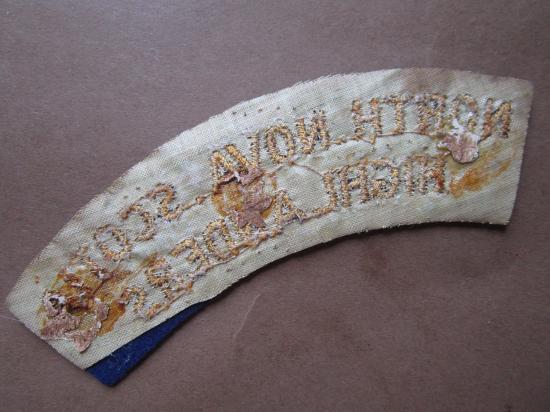 A nice mid i.e late war time period British made Canadian North Nova Scotia Highlanders embroided shoulder title
