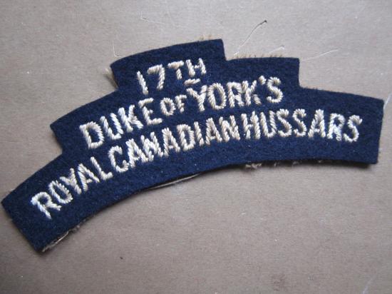 A difficult to find typical British made 17th Duke of York’s – Royal Canadian Hussars embroided shoulder title