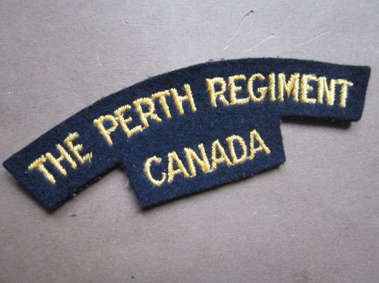 A nice and unissued British made embroided Canadian The Perth Regiment shoulder title