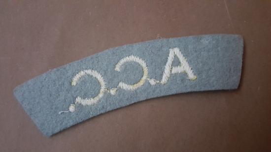 A nice un-issued glue i.e pasting backing A.C.C. (Army Catering Corps) embroided shoulder title