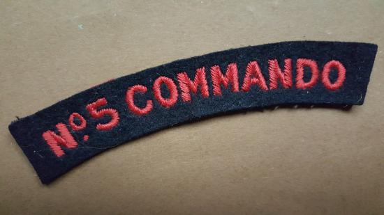 A good condition mid war period No.5 Commando embroided shoulder title