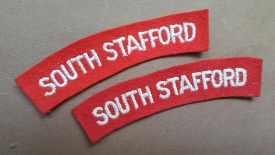 A nice matching set of white on red embroidered South Stafford shoulder titles