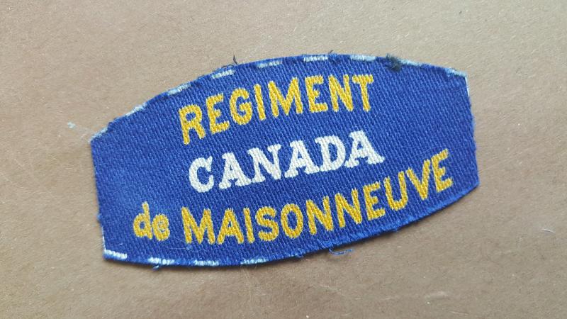 A nice British made Le Régiment de Maisonneuve shoulder title i.e badge