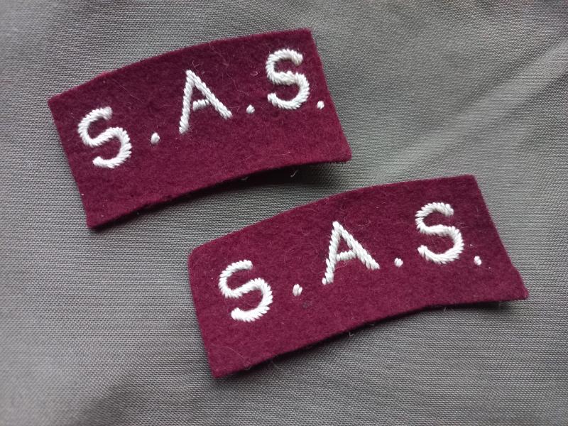 A nice and scarce pair of British made Belgium Special Air Service shoulder titles