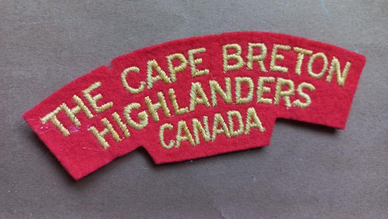 A good example of a typical British made Canadian The Cape Breton Highlanders embroided shoulder title
