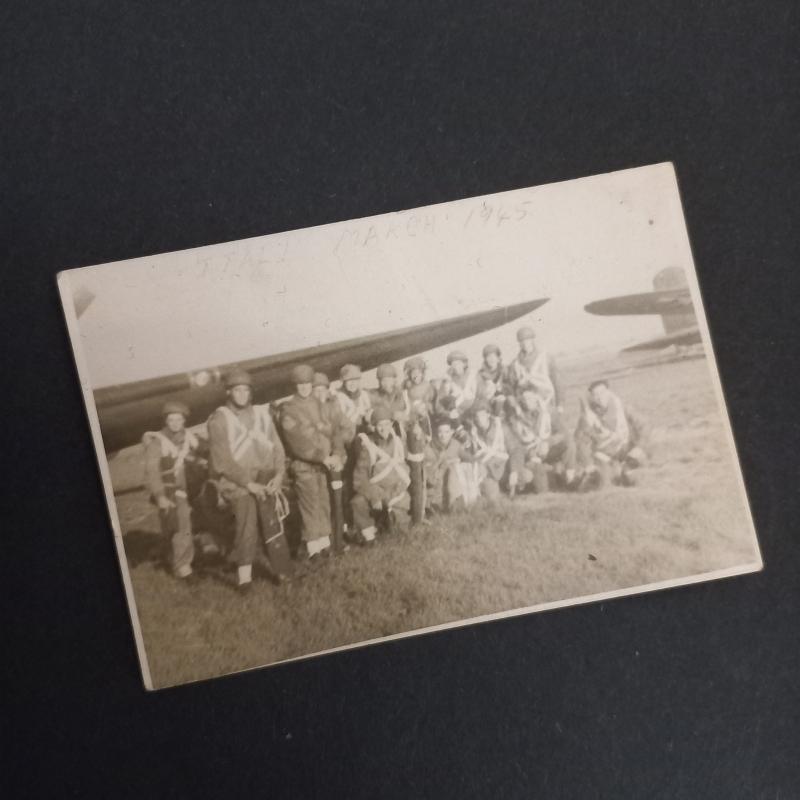 A original and - regrettably small 8.4cm by 5.7cm - period made group photograph dispicting men of the 2nd Independent Parachute Brigade getting ready for a most likely practice jump in full kit including Enfield or Bren valise's in Italy March 1945