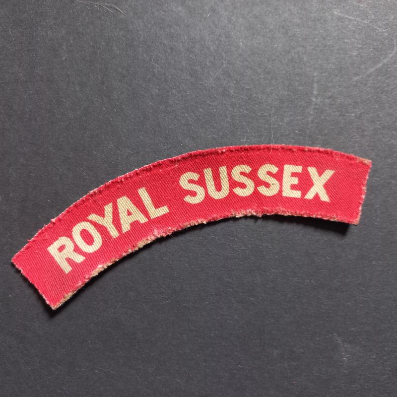 A neat and attractive printed Royal Sussex shoulder title