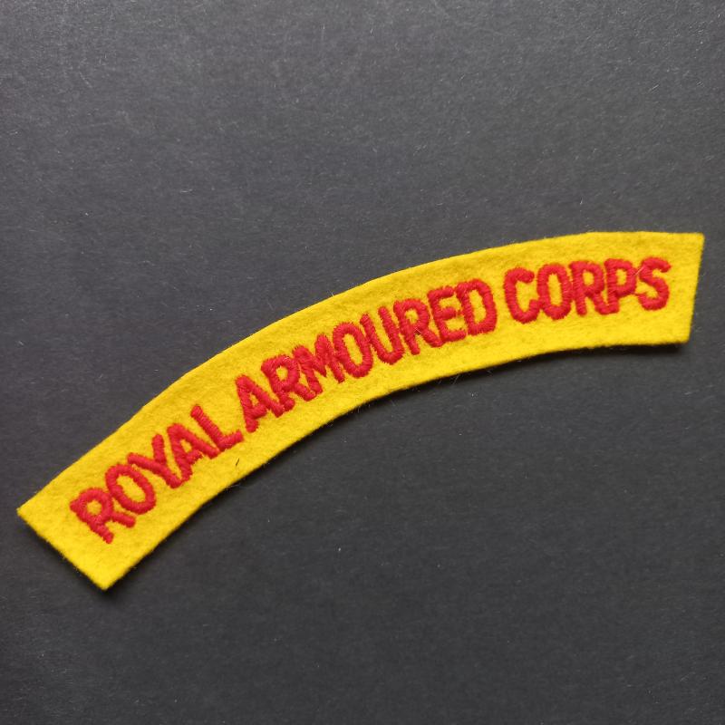 A nice and attractive - mid war period with a period glue i.e paste backing - red on yellow embroided Royal Armoured Corps shoulder title