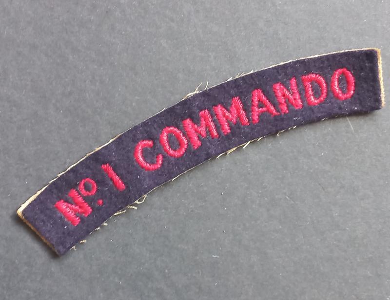 A very attractive - nicely worn and issued - No.1 Commando shoulder title