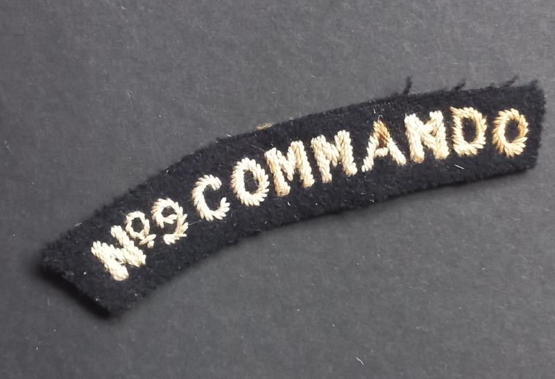 A superb - albeit regrettably single - typical early British made Number 9 Commando shoulder title